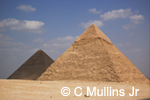 Pyramids at Giza under blue sky